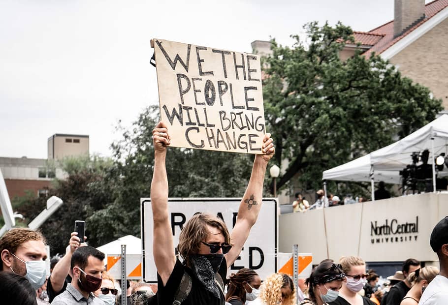 We the people will bring change. Black Lives Matter protestor seeking unity during a divided time. Photo taken at George Floyd Family Memorial Service. Black Lives Matter. Photo by munshots on Unsplash.